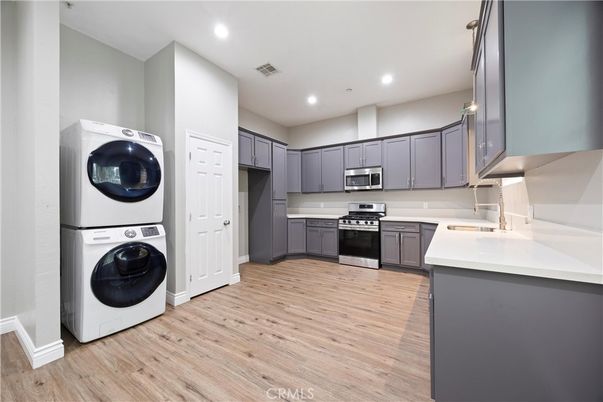 Interior, Kitchen, Recessed Lighting, Utility Closets, Washer, Wood Texture Flooring