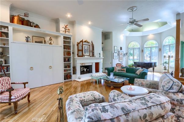 Fireplace, Interior, Living room, Piano, Recessed Lighting, Wood Texture Flooring
