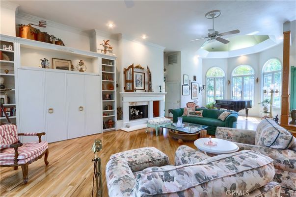 Fireplace, Interior, Living room, Piano, Recessed Lighting, Wood Texture Flooring