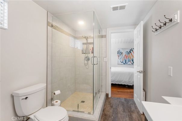 Bathroom, Bedroom, Glass Shower, Interior, Recessed Lighting, Wood Texture Flooring