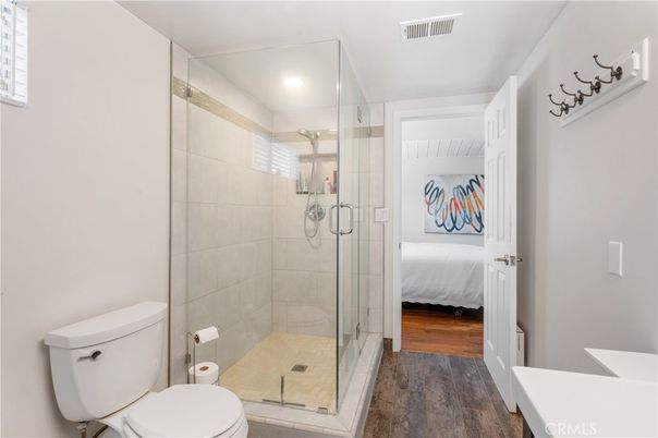 Bathroom, Bedroom, Glass Shower, Interior, Recessed Lighting, Wood Texture Flooring