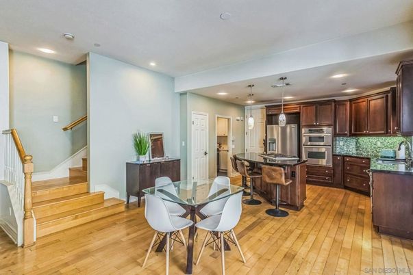 Dining room, Interior, Kitchen, Pendant Lights, Recessed Lighting, Stainless Steel Appliances, Wood Texture Flooring