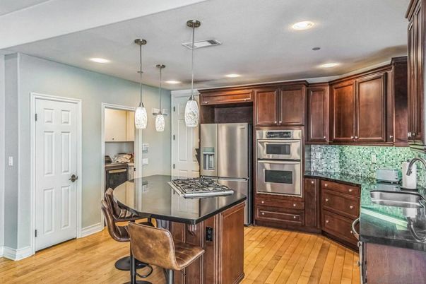 Dining room, Interior, Kitchen, Pendant Lights, Recessed Lighting, Stainless Steel Appliances, Wood Texture Flooring