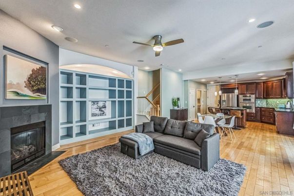 Dining room, Fireplace, Interior, Kitchen, Pendant Lights, Recessed Lighting, Stainless Steel Appliances, Wood Texture Flooring