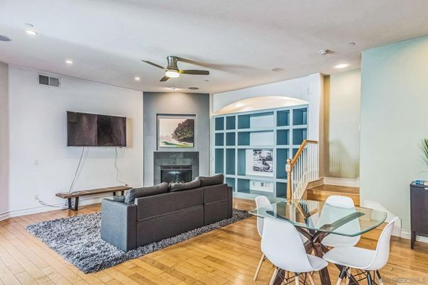 Dining room, Fireplace, Interior, Living room, Recessed Lighting, Wood Texture Flooring