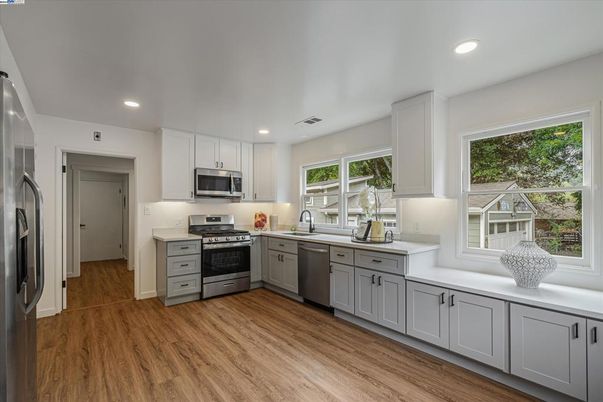 Interior, Kitchen, Recessed Lighting, Stainless Steel Appliances, Wood Texture Flooring