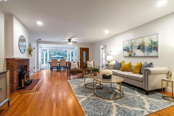 Dining room, Fireplace, Interior, Living room, Recessed Lighting, Wood Texture Flooring