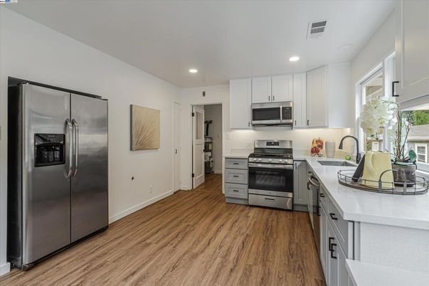 Interior, Kitchen, Recessed Lighting, Stainless Steel Appliances, Wood Texture Flooring