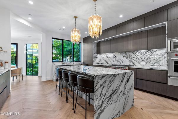 Chandelier, Interior, Kitchen, Marble Walls, Recessed Lighting, Stainless Steel Appliances, Wood Texture Flooring