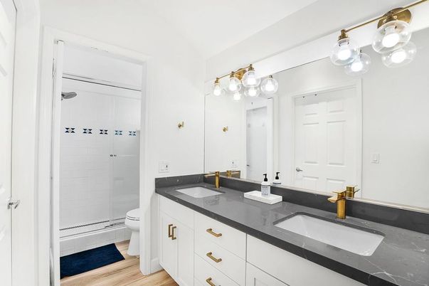 Bathroom, Dual Sink Vanities, Glass Shower, Interior, Wood Texture Flooring