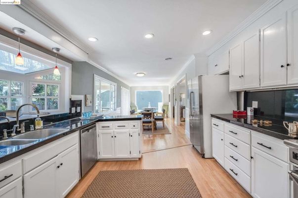 Dining room, Interior, Kitchen, Pendant Lights, Recessed Lighting, Stainless Steel Appliances, Wood Texture Flooring