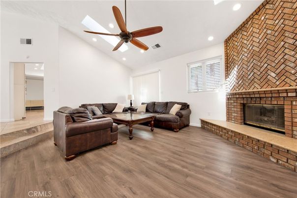 Fireplace, Interior, Living room, Recessed Lighting, Stone Walls, Wood Texture Flooring