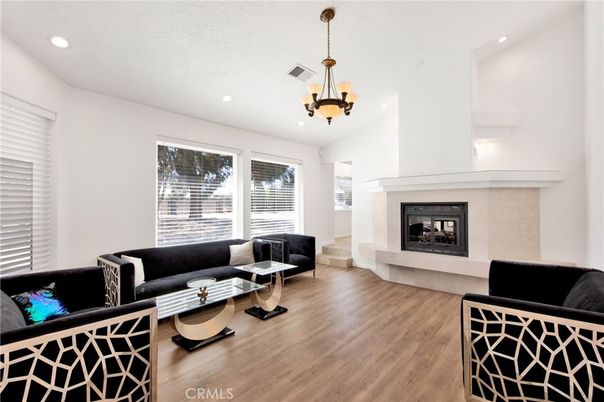 Chandelier, Fireplace, Interior, Living room, Recessed Lighting, Wood Texture Flooring