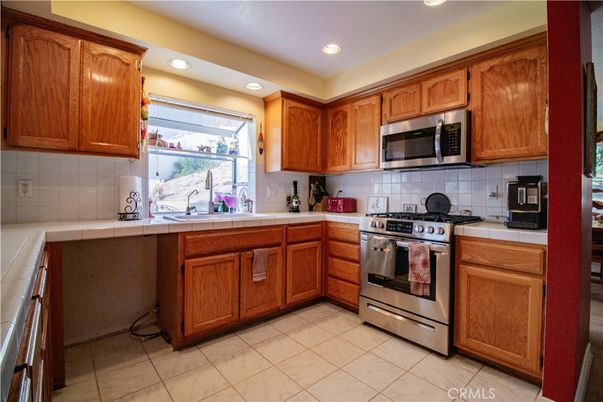Interior, Kitchen, Recessed Lighting, Stainless Steel Appliances, Tile Countertops