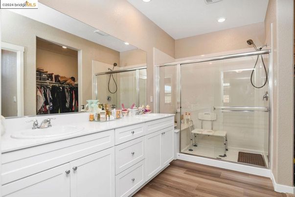 Bathroom, Dual Sink Vanities, Glass Shower, Interior, Recessed Lighting, Wood Texture Flooring