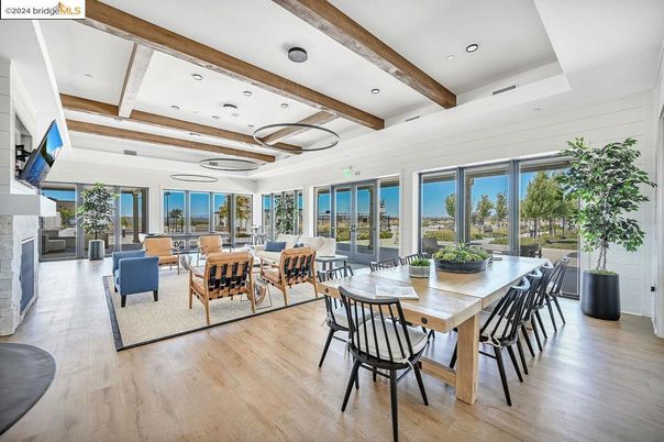Dining room, Fireplace, Interior, Living room, Recessed Lighting, Water, Wooden Beams, Wood Texture Flooring