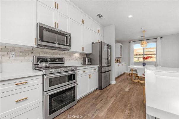 Dining room, Interior, Kitchen, Pendant Lights, Recessed Lighting, Stainless Steel Appliances, Wood Texture Flooring