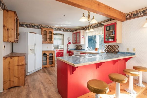 Interior, Kitchen, Pendant Lights, Tile Countertops, Wood Texture Flooring