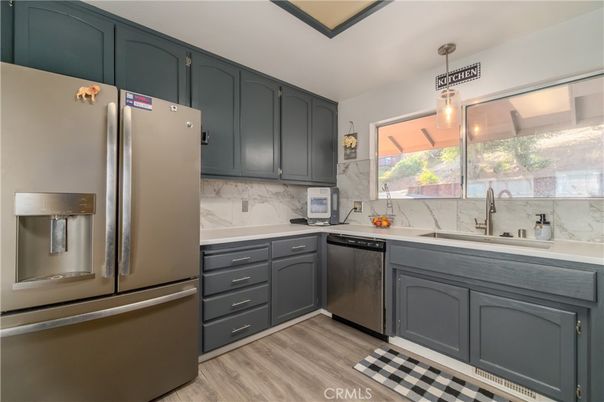 Interior, Kitchen, Marble Walls, Pendant Lights, Stainless Steel Appliances, Wood Texture Flooring