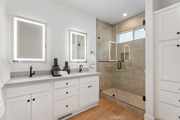Bathroom, Dual Sink Vanities, Glass Shower, Interior, Recessed Lighting, Wood Texture Flooring