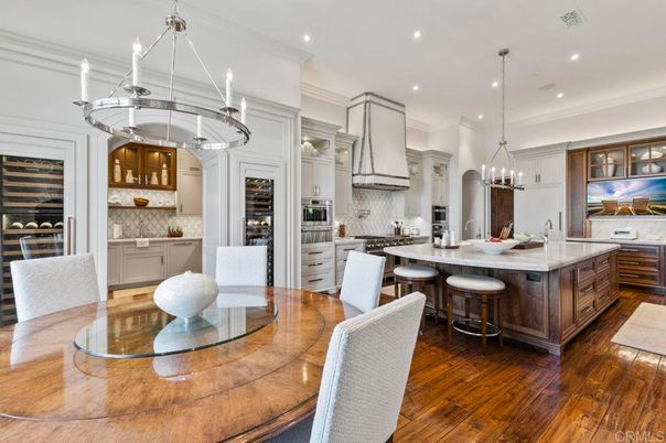 Chandelier, Dining room, Interior, Kitchen, Pendant Lights, Recessed Lighting, Stainless Steel Appliances, Wood Texture Flooring