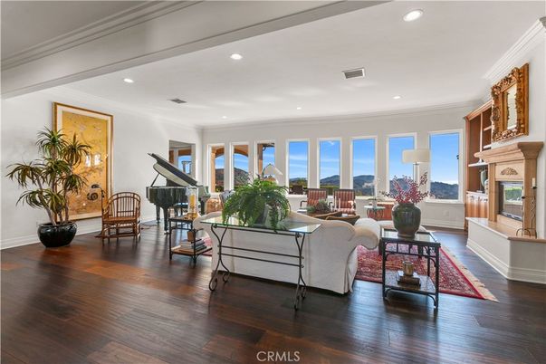 Fireplace, Interior, Living room, Piano, Recessed Lighting, Wood Texture Flooring