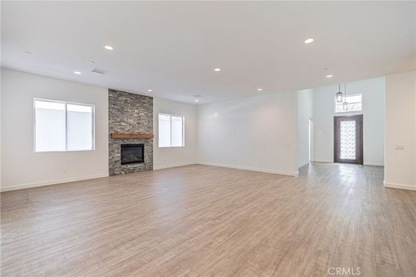 Empty room, Fireplace, Interior, Pendant Lights, Recessed Lighting, Wood Texture Flooring