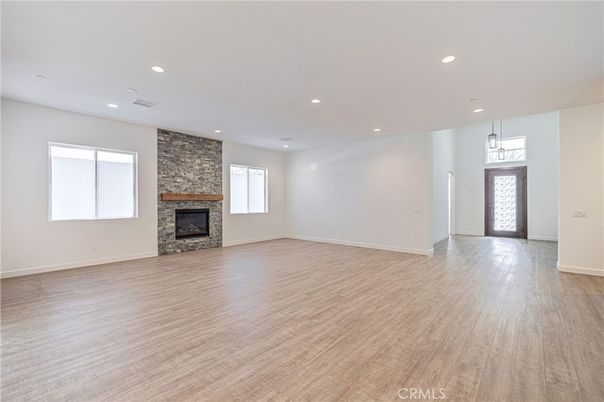 Empty room, Fireplace, Interior, Pendant Lights, Recessed Lighting, Wood Texture Flooring