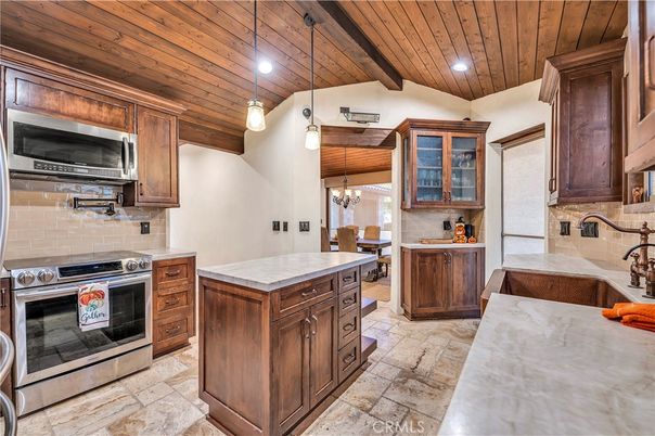 Chandelier, Dining room, Interior, Kitchen, Pendant Lights, Recessed Lighting, Stainless Steel Appliances, Wooden Beams, Wooden Ceilings