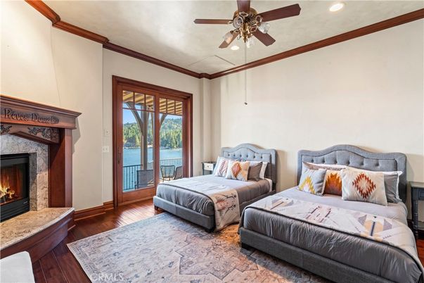 Bedroom, Fireplace, Interior, Recessed Lighting, Water, Wood Texture Flooring