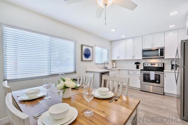 Dining room, Interior, Kitchen, Recessed Lighting, Stainless Steel Appliances, Wood Texture Flooring