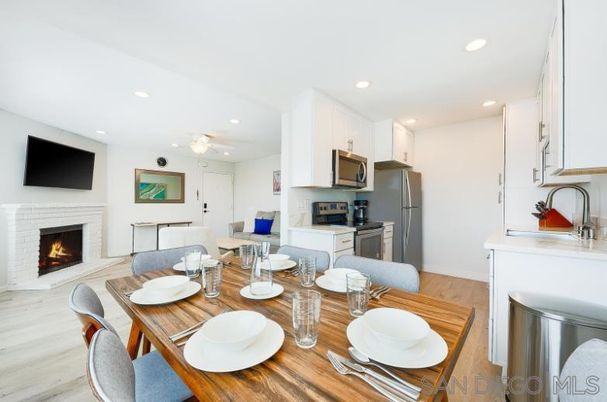 Dining room, Fireplace, Interior, Kitchen, Living room, Recessed Lighting, Stainless Steel Appliances, Wood Texture Flooring