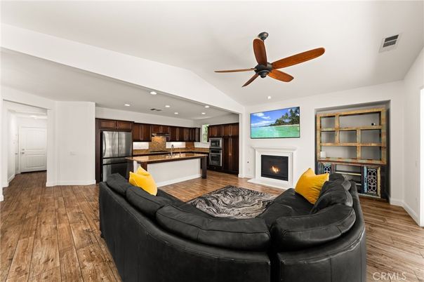 Fireplace, Interior, Kitchen, Living room, Recessed Lighting, Stainless Steel Appliances, Wood Texture Flooring