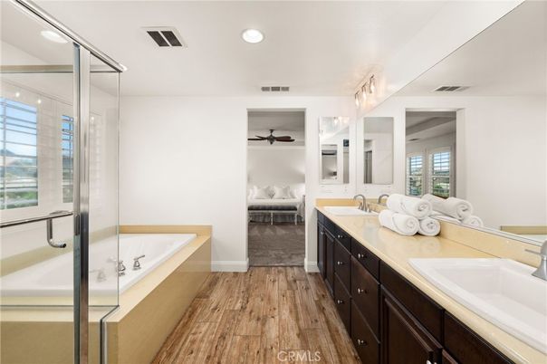 Bathroom, Bedroom, Dual Sink Vanities, Glass Shower, Interior, Recessed Lighting, Wood Texture Flooring