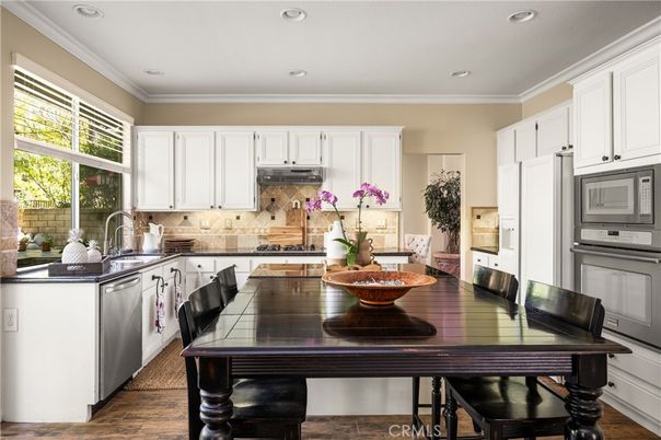 Dining room, Interior, Kitchen, Recessed Lighting, Stainless Steel Appliances, Wood Texture Flooring