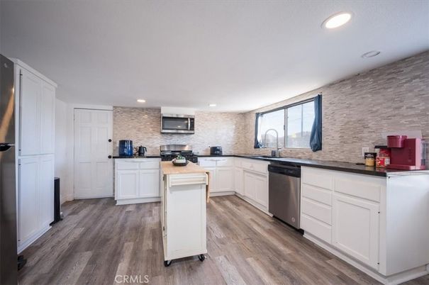 Interior, Kitchen, Recessed Lighting, Stainless Steel Appliances, Stone Walls, Wood Texture Flooring