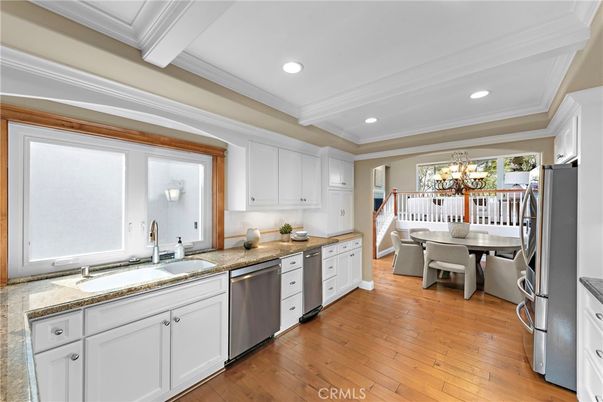 Chandelier, Dining room, Interior, Kitchen, Recessed Lighting, Stainless Steel Appliances, Wood Texture Flooring