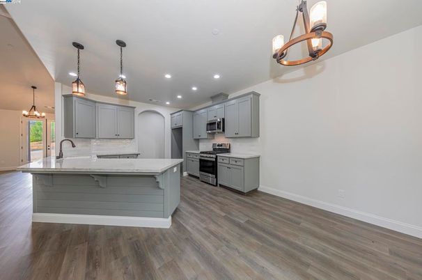 Interior, Kitchen, Pendant Lights, Recessed Lighting, Stainless Steel Appliances, Wood Texture Flooring