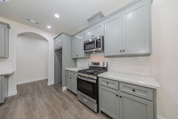 Interior, Kitchen, Recessed Lighting, Stainless Steel Appliances, Wood Texture Flooring