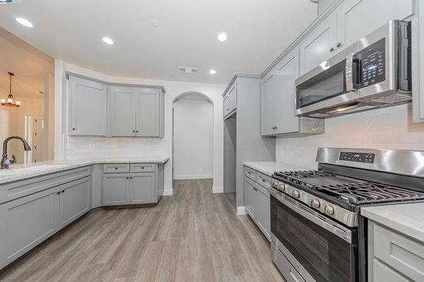 Interior, Kitchen, Pendant Lights, Recessed Lighting, Stainless Steel Appliances, Wood Texture Flooring