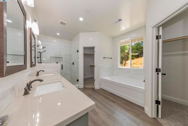 Bathroom, Dual Sink Vanities, Glass Shower, Interior, Recessed Lighting, Wood Texture Flooring