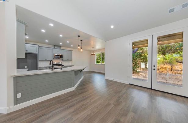 Interior, Kitchen, Pendant Lights, Recessed Lighting, Stainless Steel Appliances, Wood Texture Flooring