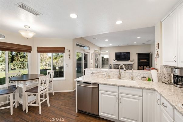 Dining room, Fireplace, Interior, Kitchen, Recessed Lighting, Wood Texture Flooring