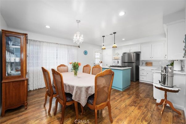 Chandelier, Dining room, Interior, Kitchen, Pendant Lights, Recessed Lighting, Stainless Steel Appliances, Wood Texture Flooring