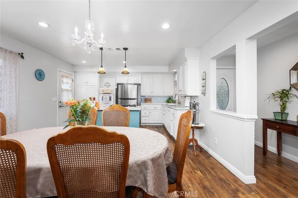 Dining room, Interior, Kitchen, Pendant Lights, Recessed Lighting, Stainless Steel Appliances, Wood Texture Flooring