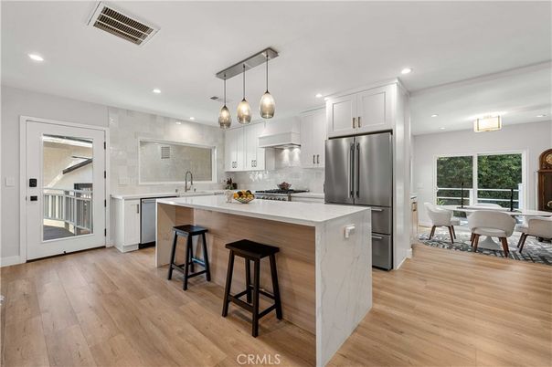 Dining room, Interior, Kitchen, Pendant Lights, Recessed Lighting, Stainless Steel Appliances, Wood Texture Flooring