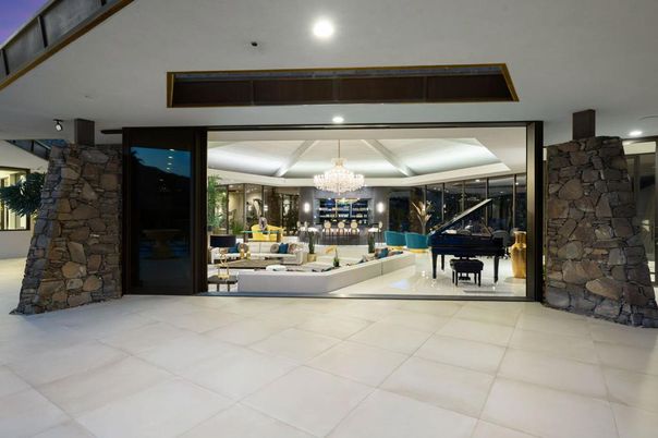 Chandelier, Interior, Living room, Piano, Recessed Lighting, Stone Walls