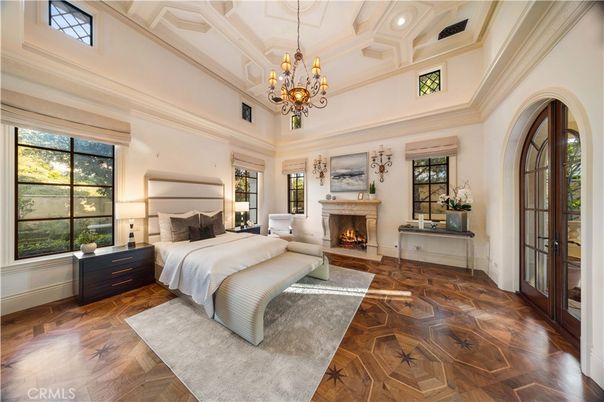 Bedroom, Chandelier, Fireplace, Interior, Recessed Lighting, Wood Texture Flooring