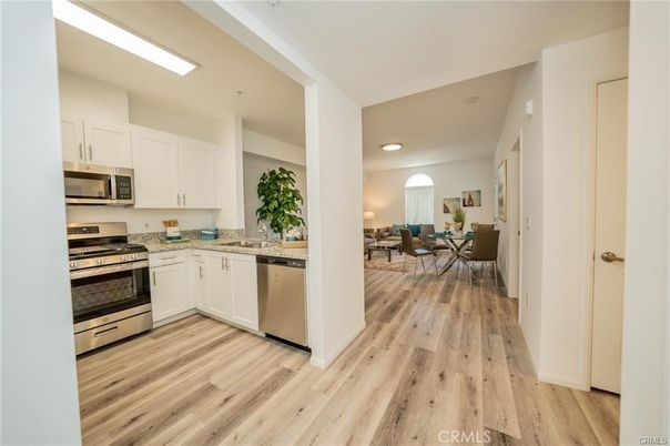 Dining room, Interior, Kitchen, Recessed Lighting, Stainless Steel Appliances, Wood Texture Flooring