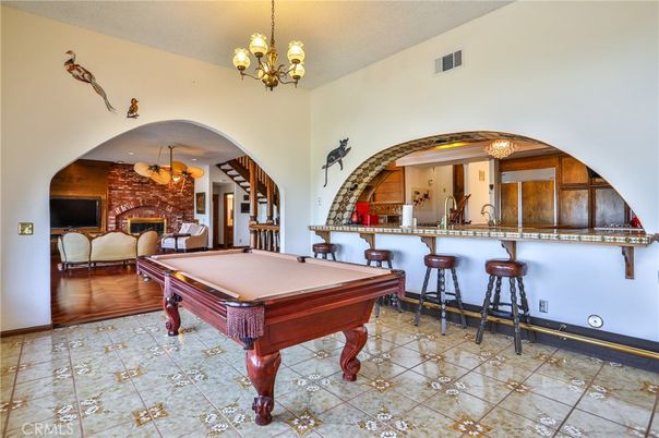 Billiard Table, Chandelier, Fireplace, Game Room, Interior, Stone Walls